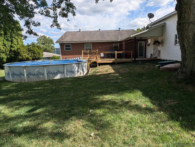 view of yard featuring a swimming pool side deck