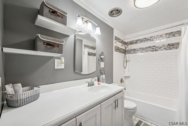 full bathroom with vanity, tile patterned floors, toilet, and shower / bath combo with shower curtain