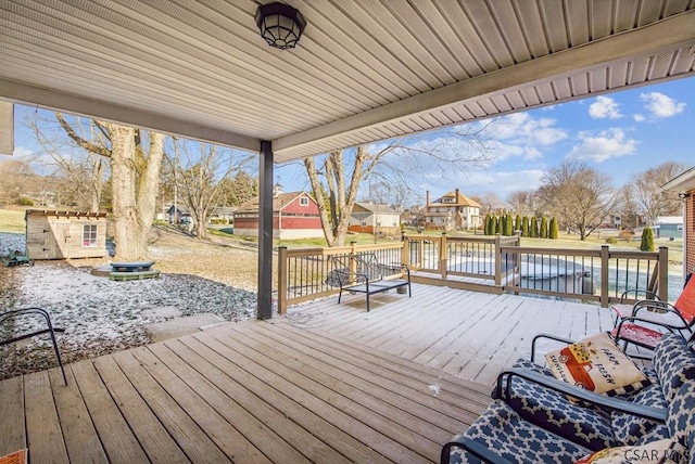 deck with a storage shed