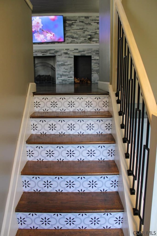 stairway with a fireplace