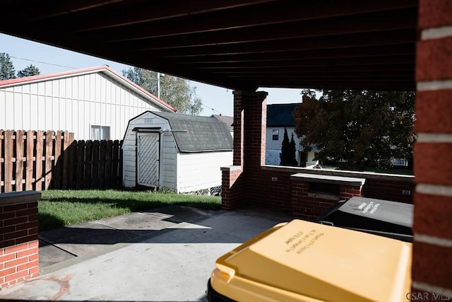 view of patio with a storage unit