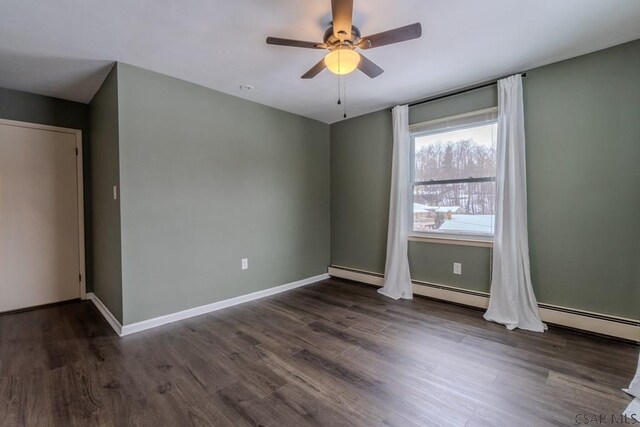 unfurnished room featuring dark wood-type flooring and ceiling fan