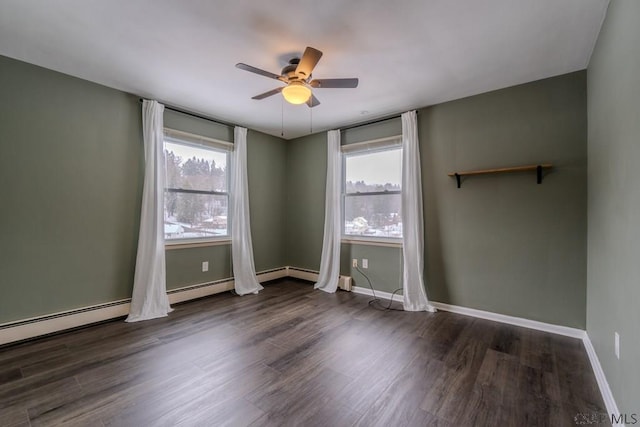 empty room with dark hardwood / wood-style floors and ceiling fan