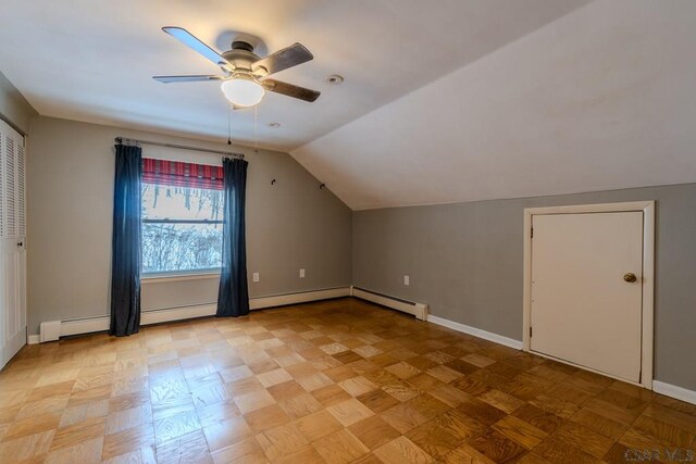 bonus room with light parquet floors, lofted ceiling, and ceiling fan