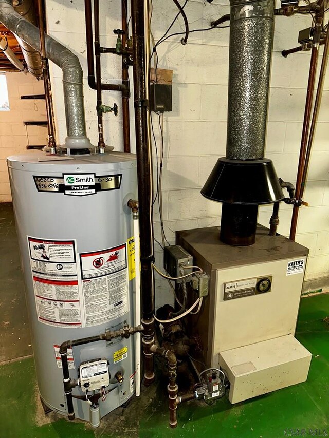 utility room with gas water heater