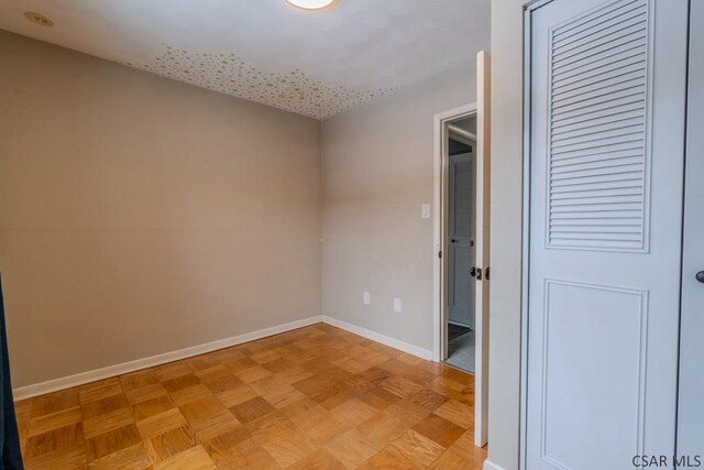 empty room featuring light parquet flooring