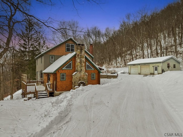 view of front of house with a garage and a deck