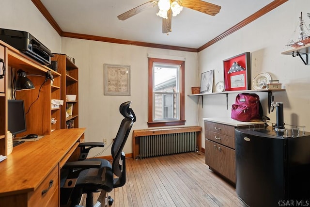 office area featuring crown molding, ceiling fan, radiator heating unit, and light hardwood / wood-style floors