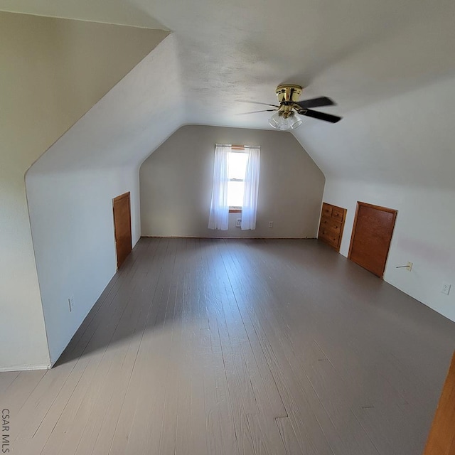 additional living space with lofted ceiling, ceiling fan, and light hardwood / wood-style flooring