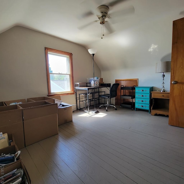 office featuring vaulted ceiling, ceiling fan, and light hardwood / wood-style floors