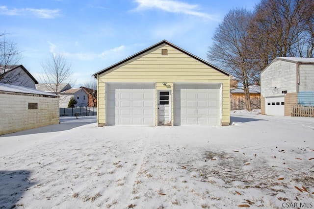 view of snow covered garage