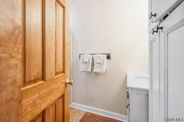 bathroom with vanity and baseboards