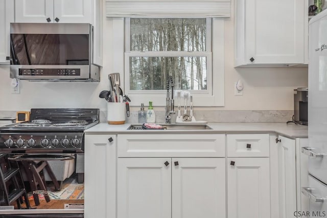 kitchen with light countertops and white cabinets