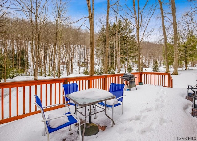 snow covered deck featuring grilling area