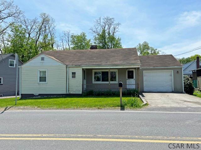 340 Hostetler Rd, Johnstown, PA 15904 - ranch-style house featuring asphalt driveway, a garage, a front lawn, and a chimney