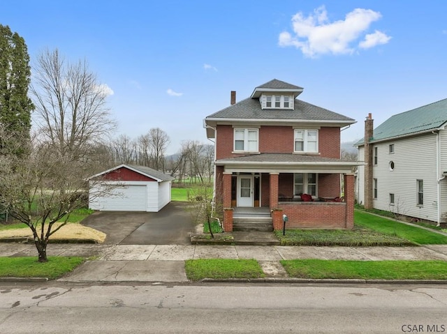 624 Oden St, Confluence, PA 15424 - traditional style home featuring covered porch, a chimney, a detached garage, brick siding, and an outdoor structure