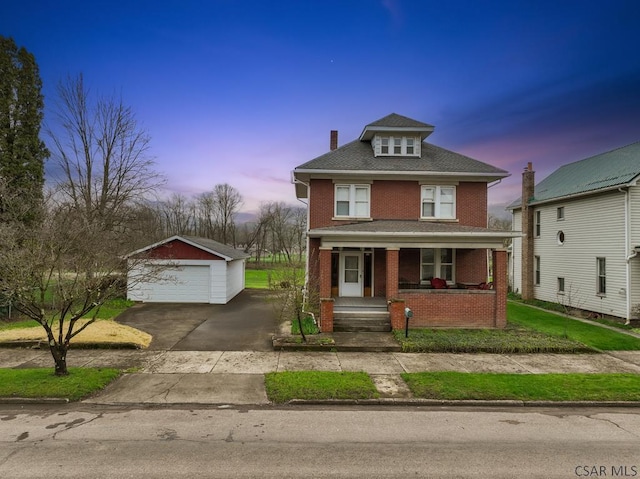 624 Oden St, Confluence, PA 15424 - traditional style home featuring a porch, a chimney, a detached garage, brick siding, and an outdoor structure
