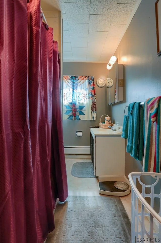 bathroom with a baseboard radiator and vanity