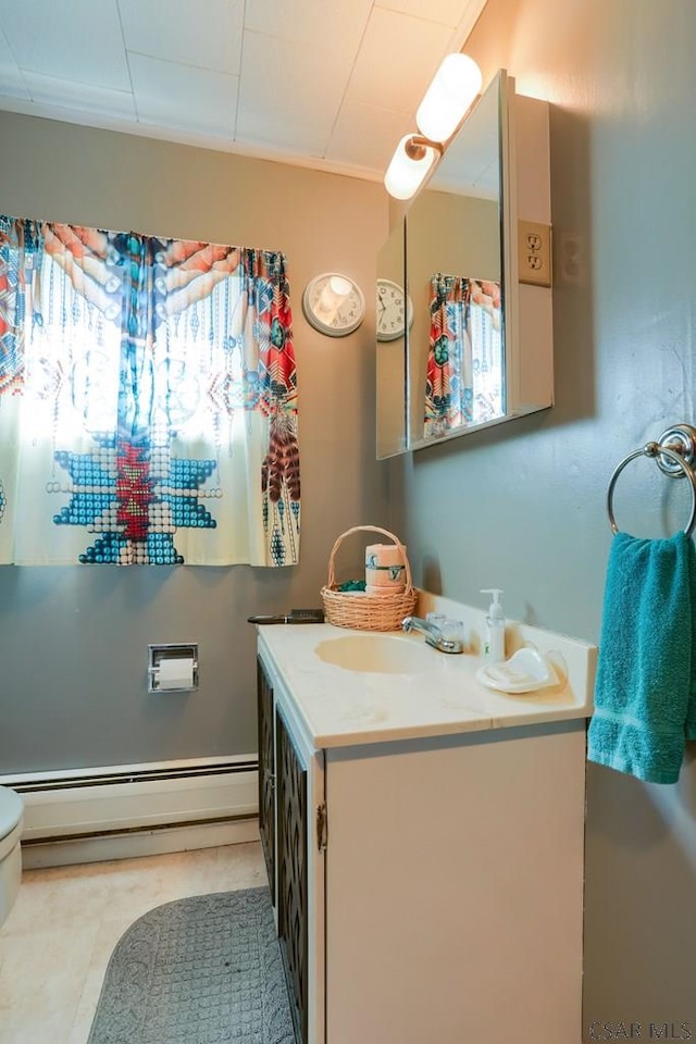 bathroom with vanity and a baseboard radiator