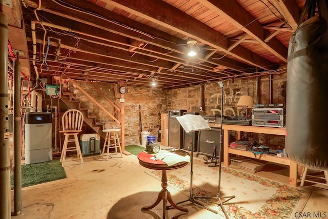 unfinished basement with washer / dryer and stairway