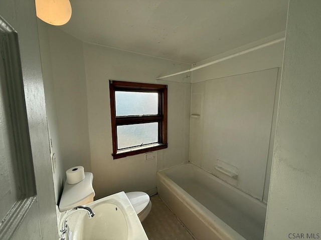 bathroom featuring  shower combination, a sink, and toilet