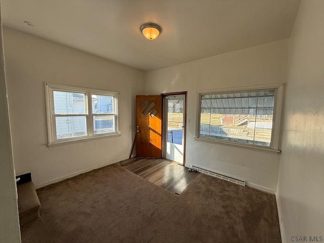 interior space featuring a baseboard radiator and baseboards