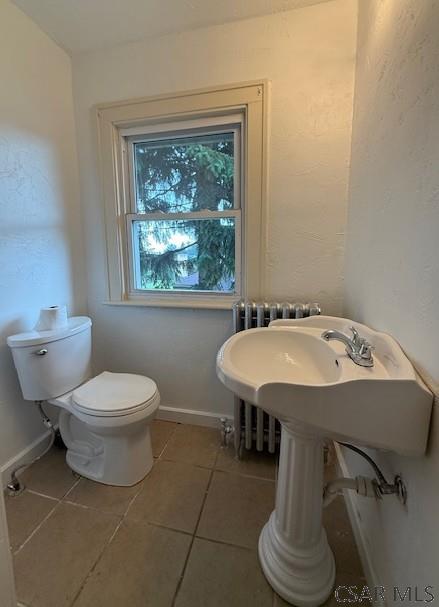 106 Lucetta St, Johnstown, PA 15905 - bathroom with tile patterned floors, toilet, and baseboards