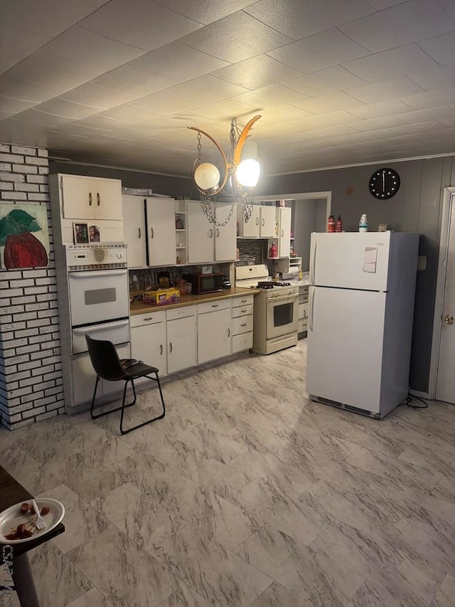 116 Blawn St, Johnstown, PA 15906 - kitchen with white appliances, white cabinets, open shelves, dark countertops, and a warming drawer