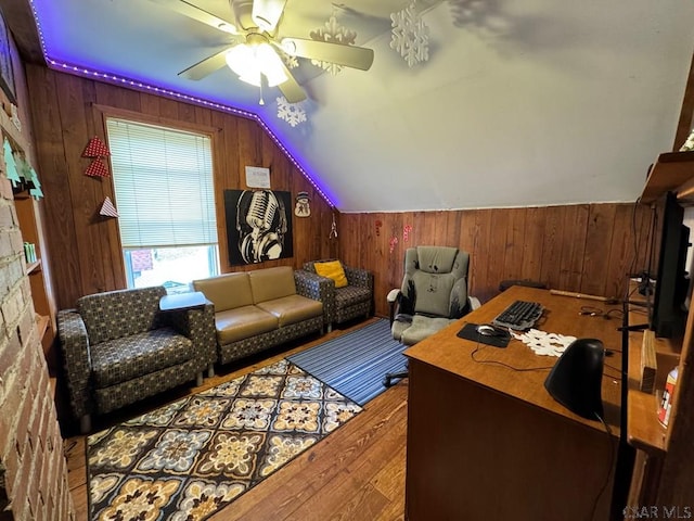 office area featuring hardwood / wood-style flooring, vaulted ceiling, and ceiling fan