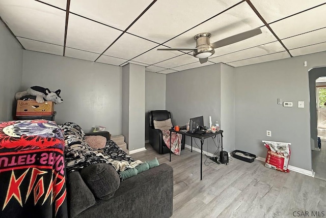 304 Oak St, Conemaugh, PA 15909 - living room with ceiling fan, a paneled ceiling, wood finished floors, arched walkways, and baseboards
