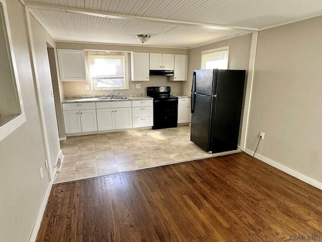 kitchen with white cabinets, sink, light wood-type flooring, and black appliances