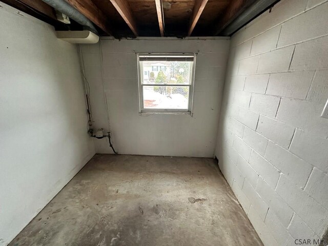 view of side of home featuring central AC unit, a patio area, and a lawn