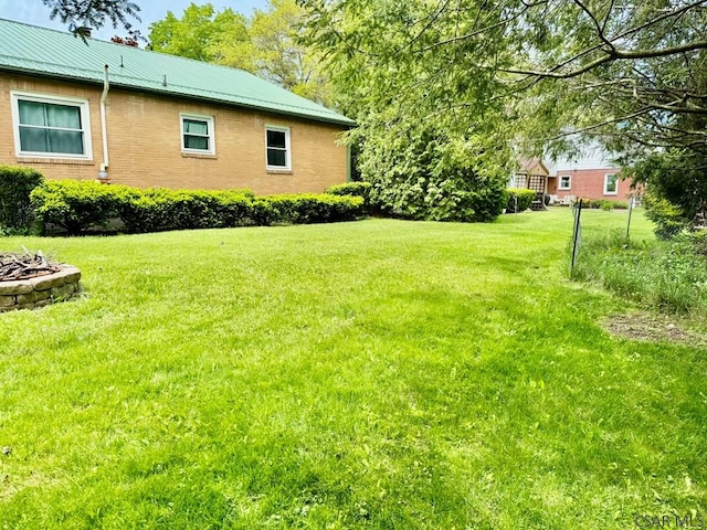 1502 Goucher St, Johnstown, PA 15905 - view of green lawn featuring an outdoor fire pit