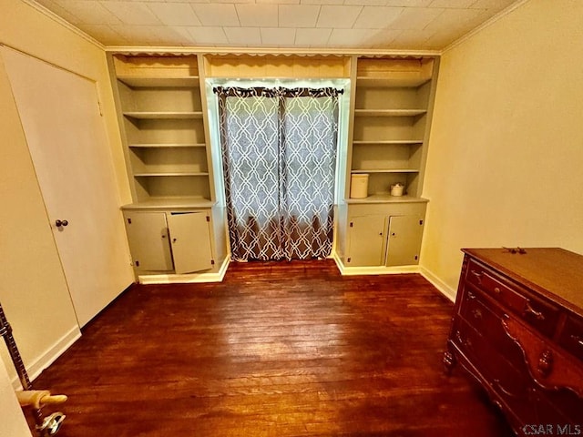 1502 Goucher St, Johnstown, PA 15905 - unfurnished dining area featuring built in features, dark wood-style flooring, crown molding, and baseboards
