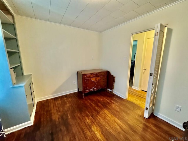 1502 Goucher St, Johnstown, PA 15905 - unfurnished bedroom featuring crown molding, wood finished floors, and baseboards