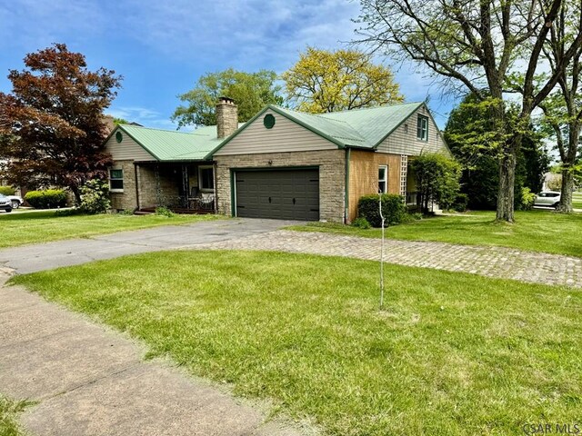 1502 Goucher St, Johnstown, PA 15905 - ranch-style home featuring driveway, a chimney, a front lawn, and an attached garage
