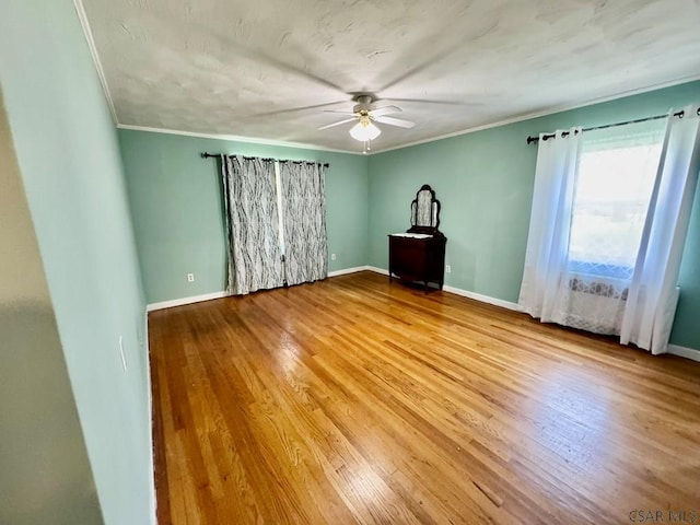 1502 Goucher St, Johnstown, PA 15905 - empty room featuring a ceiling fan, crown molding, baseboards, and wood finished floors