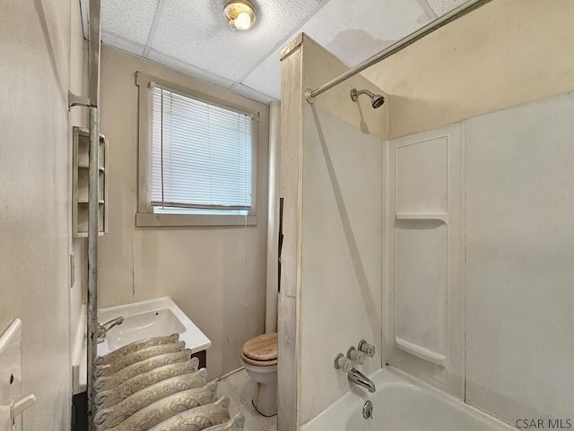 full bathroom with shower / washtub combination, a paneled ceiling, vanity, and toilet