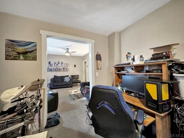 office area with ceiling fan and carpet flooring