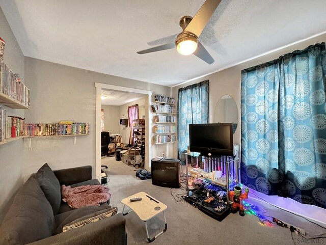 living room with light carpet and ceiling fan