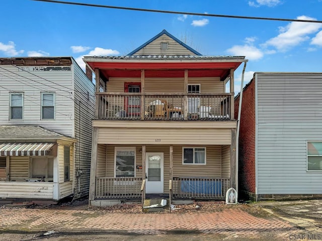 view of front facade with a porch and a balcony