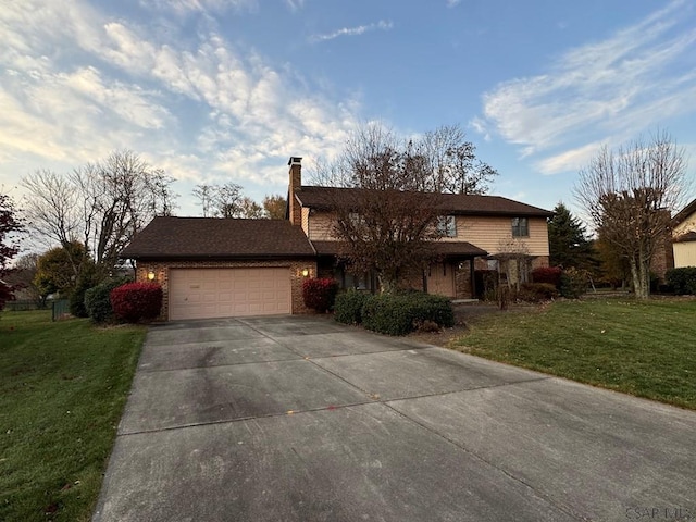 view of front of home with a garage and a front lawn