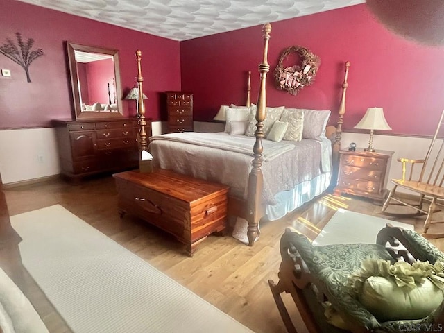 bedroom featuring wood finished floors