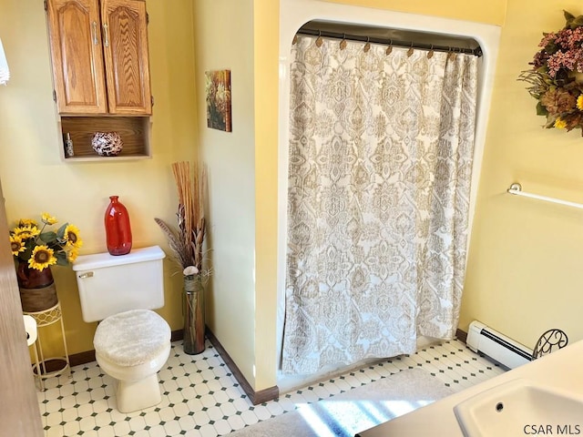 bathroom with a shower with curtain, toilet, baseboards, and baseboard heating