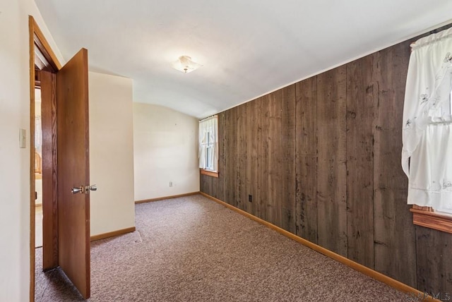 1253 Stoystown Rd, Friedens, PA 15541 - unfurnished room with baseboards, wooden walls, carpet floors, and lofted ceiling