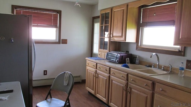 1508 Gillespie Ave, Portage, PA 15946 - kitchen featuring a sink, freestanding refrigerator, plenty of natural light, and baseboard heating