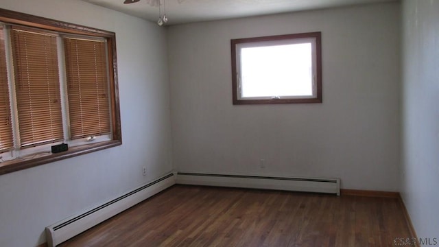 1508 Gillespie Ave, Portage, PA 15946 - spare room with a baseboard radiator, dark wood-style floors, and ceiling fan