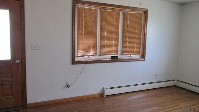 1508 Gillespie Ave, Portage, PA 15946 - unfurnished room with a baseboard heating unit, wood finished floors, and baseboards