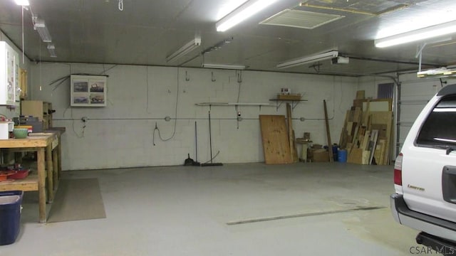 1508 Gillespie Ave, Portage, PA 15946 - garage with a workshop area and a garage door opener