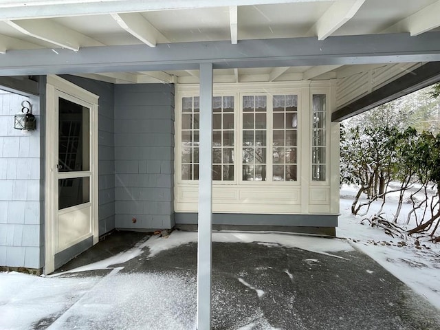 view of snow covered property entrance